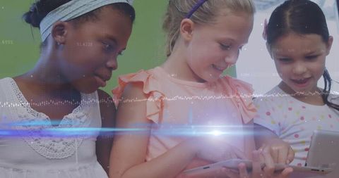 Diverse Group of Children Exploring Technology with Tablets