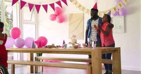 family birthday celebration with colorful balloons and decorations - Download Free Stock Images Pikwizard.com