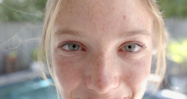 Close-Up Portrait of Smiling Girl with Freckles in Natural Light - Download Free Stock Images Pikwizard.com