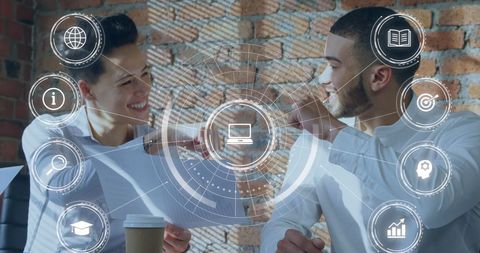 Diverse Colleagues Celebrate Teamwork in Office with Technology Overlay