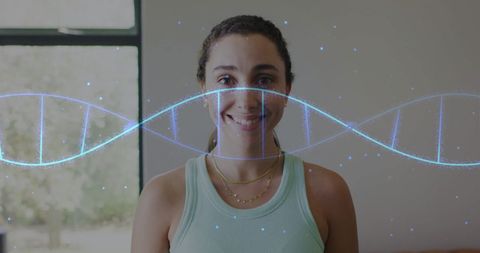 caucasian woman standing indoors with a digital representation of a dna strand superimposed. radiant facial expression showcasing a connection with scientific and futuristic themes. background emphasizes a homely environment. perfect for illustrating concepts related to genetics, life sciences, digital technology, or personal tracking technology.