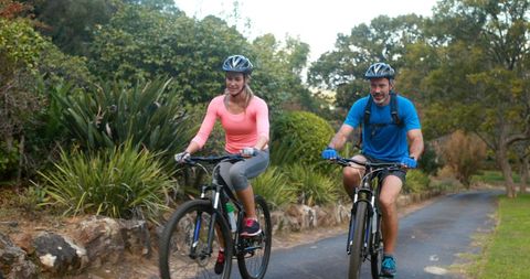 Active Couple Enjoys Cycling in the Park