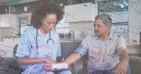 Nurse monitoring blood pressure technology home healthcare elderly assistance