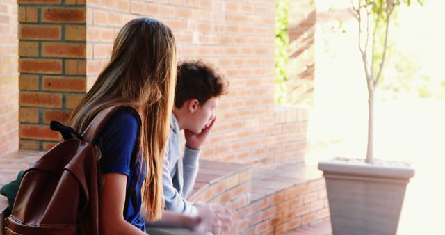 Young Students Sitting on Brick Steps Outdoors Discussing - Download Free Stock Images Pikwizard.com