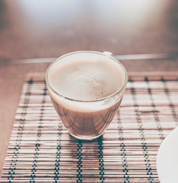 Warm Latte in Transparent Glass Cup on Wooden Mat - Download Free Stock Photos Pikwizard.com