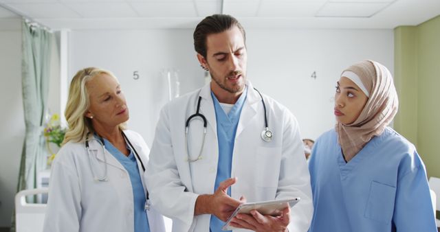 Diverse Medical Team Discussing Patient Information in Hospital - Download Free Stock Images Pikwizard.com