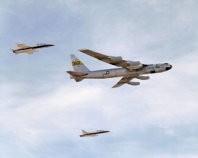 NASA's B-52B mothership, escorted by two F-18s, makes a final flyover after its last research mission that launched the X-43A on its record Mach 9.6 flight.