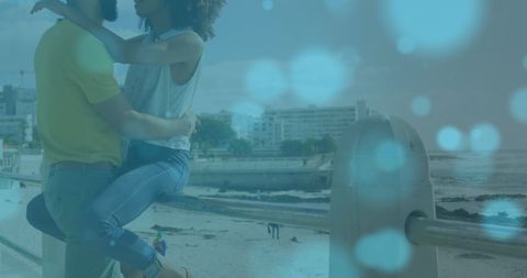 Romantic african american couple embracing by beach