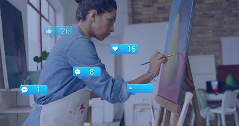 Artist Engaging in Painting Amidst Virtual Social Interactions