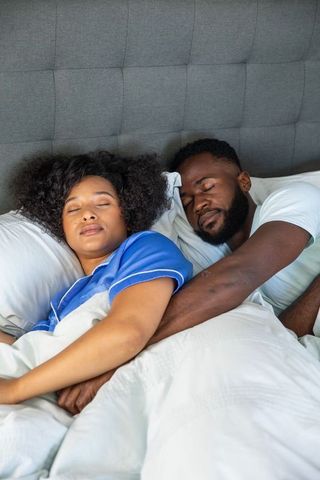 Couple Sleeping Peacefully Together in Cozy Bedroom Environment