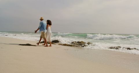 Romantic Couple Strolling on Seaside at Sunset - Download Free Stock Images Pikwizard.com