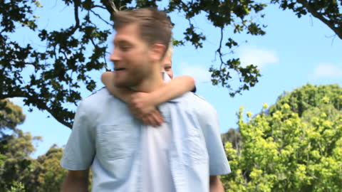 Father and Son Bonding in Park on Sunny Day