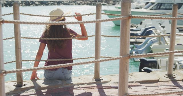Relaxing at Marina Port, Woman in Sun Hat Enjoying Summer - Download Free Stock Images Pikwizard.com