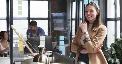 Confident young professional in modern workplace