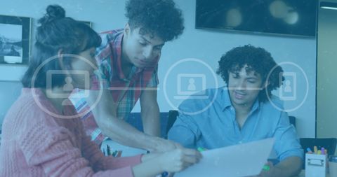 Diverse Team Collaborating Through Digital Media Interface in Modern Office