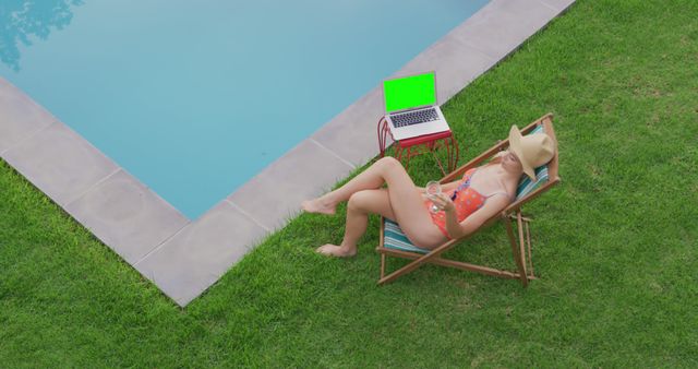 Woman Relaxing by Swimming Pool with Laptop and Drink - Download Free Stock Images Pikwizard.com