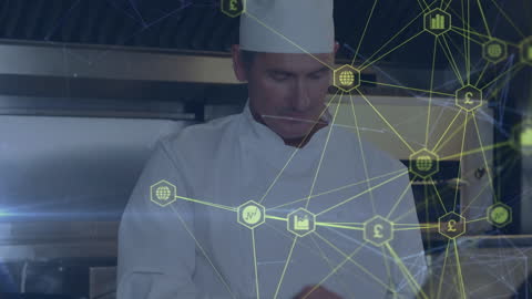 Chef Utilizing Digital Technology in Commercial Kitchen