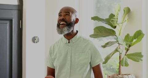 Joyful Father Preparing for Wedding Celebration at Home