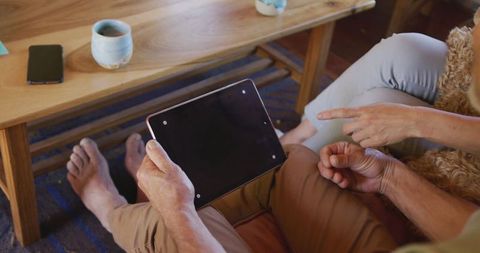 Senior Couple Engaging with Tablet in Cozy Living Room