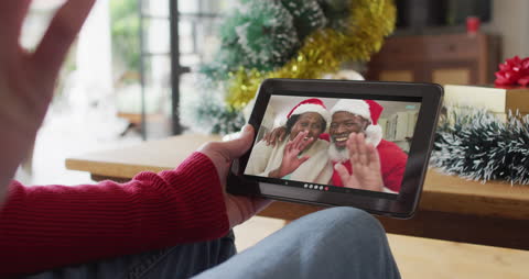 Virtual Christmas Celebration with Family Smiling in Digital Connection