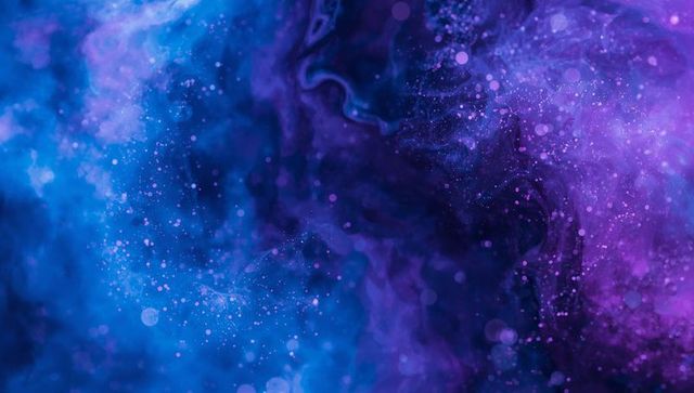 Vibrant Blue Purple Nebula Ink Swirl with Bokeh Particles and Cosmic Gradient
