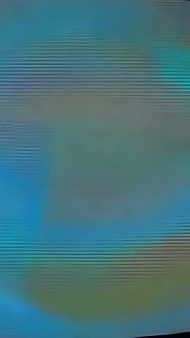 Vertical video showing curved display closeup with shifting ring, scanlines and red band