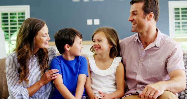 Happy Family Sitting Together on Couch at Home - Download Free Stock Images Pikwizard.com