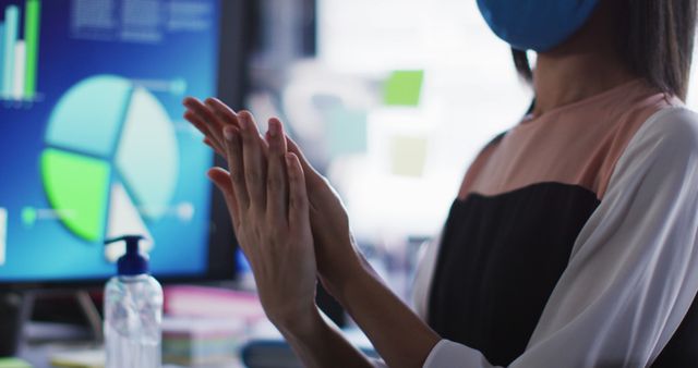 Businesswoman Sanitizing Hands in Office During Pandemic - Download Free Stock Images Pikwizard.com