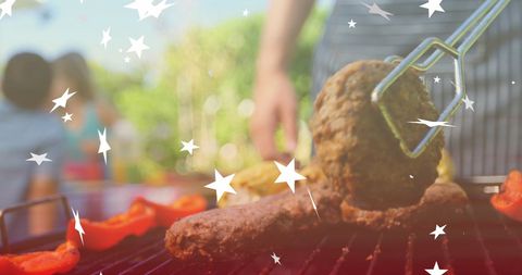 Family Enjoying Outdoor Barbecue with Grilled Foods and Star Overlay - Download Free Stock Images Pikwizard.com
