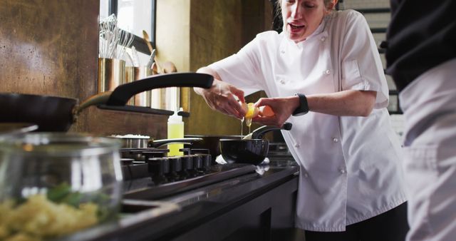 Professional Chef Cracking Egg in Restaurant Kitchen - Download Free Stock Images Pikwizard.com