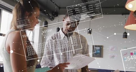 Team analyzing data with augmented reality overlays during collaborative strategy session