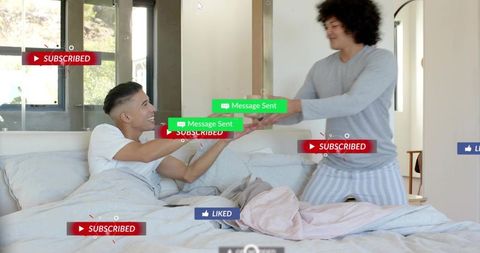 Two men sharing phone on bed with social media overlays, playful morning couple interaction