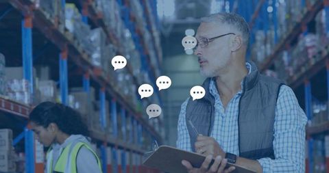 Warehouse manager entering inventory on clipboard