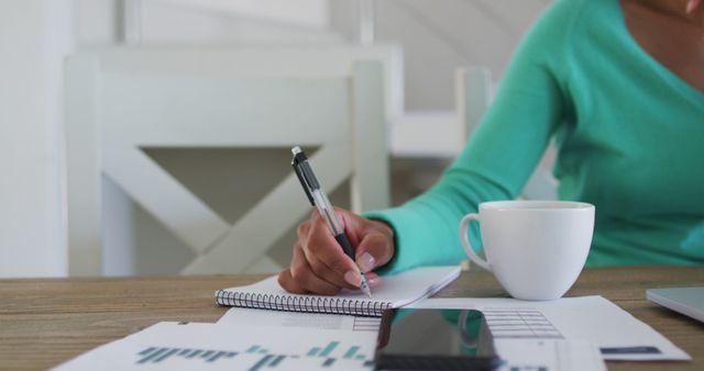 Business Woman Writing in Notebook During Coffee Break - Download Free Stock Images Pikwizard.com