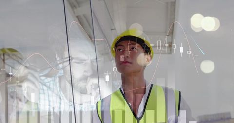 Asian Male Worker Analyzing Financial Graphs in Digital Overlay - Download Free Stock Images Pikwizard.com