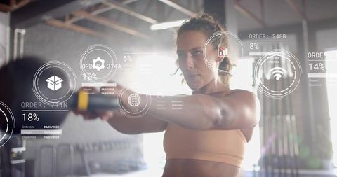 Female Athlete Lifting Kettlebell in Industrial Gym with Augmented Reality Overlays