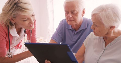 Doctor consulting senior couple