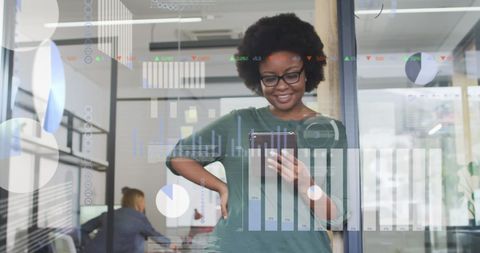 Tech-Savvy Businesswoman Analyzing Digital Financial Data in Office