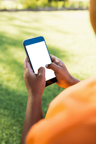 using smartphone in park with calming green background - Download Free Stock Videos Pikwizard.com