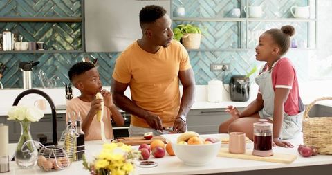 Family Bonding in Modern Kitchen with Father and Children