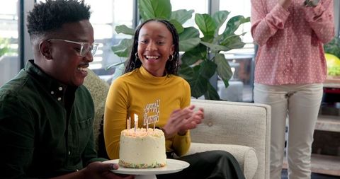 Joyful office birthday celebration with friends and colleagues