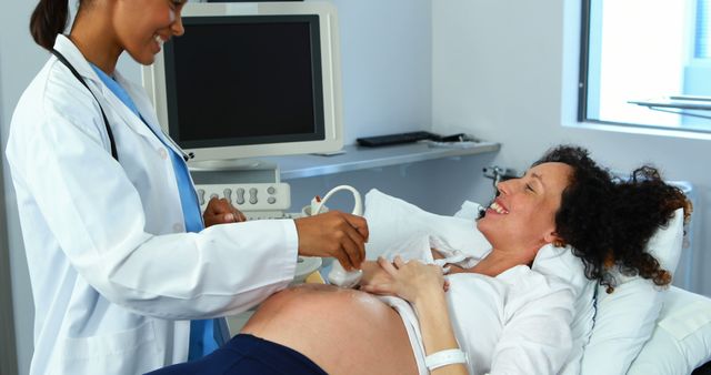 Pregnant Woman Having Ultrasound Exam with Doctor in Medical Clinic - Download Free Stock Images Pikwizard.com