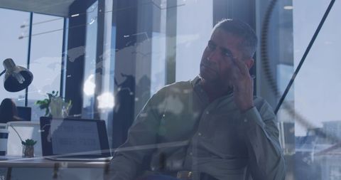 Man Analyzing Digital Data in Modern Office with Global Interface - Download Free Stock Images Pikwizard.com