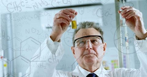 Scientist analyzing samples with mathematical formulas overlay