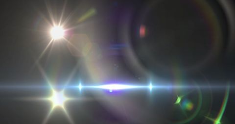 Dynamic Abstract Lens Flare and Light Beam over Dark Background