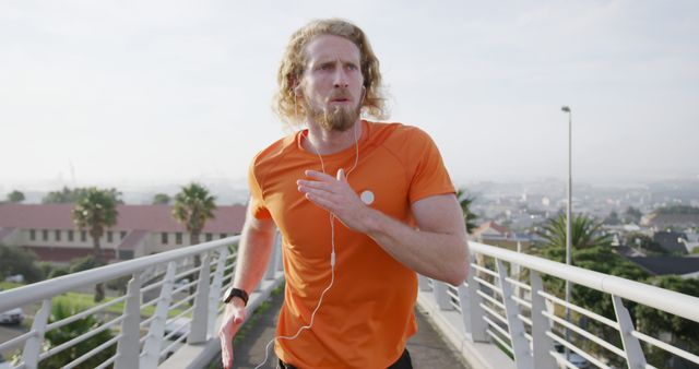 Young Man Running on Bridge with Earphones - Download Free Stock Images Pikwizard.com