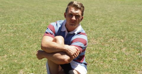 Rugby Player Relaxing is Athletic Grass Field - Download Free Stock Images Pikwizard.com