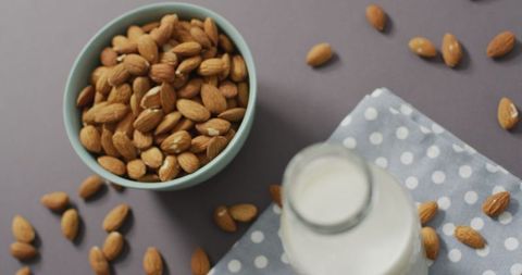 Almonds in Bowl with Plant-Based Milk Against Grey Background - Download Free Stock Images Pikwizard.com
