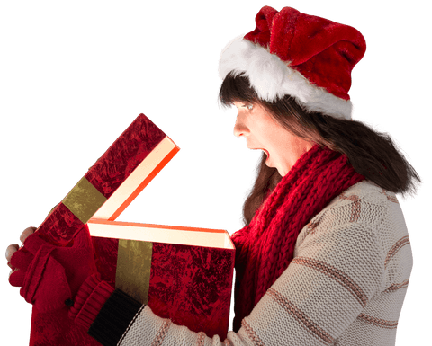 surprised woman opening glowing christmas gift with red santa hat - Download Free Stock Videos Pikwizard.com