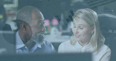 Diverse business colleagues discuss complex data insights